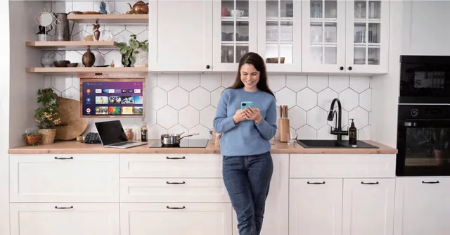 Sylvox Kitchen TV in a fitted kitchen, screen showing the smart TV interface
